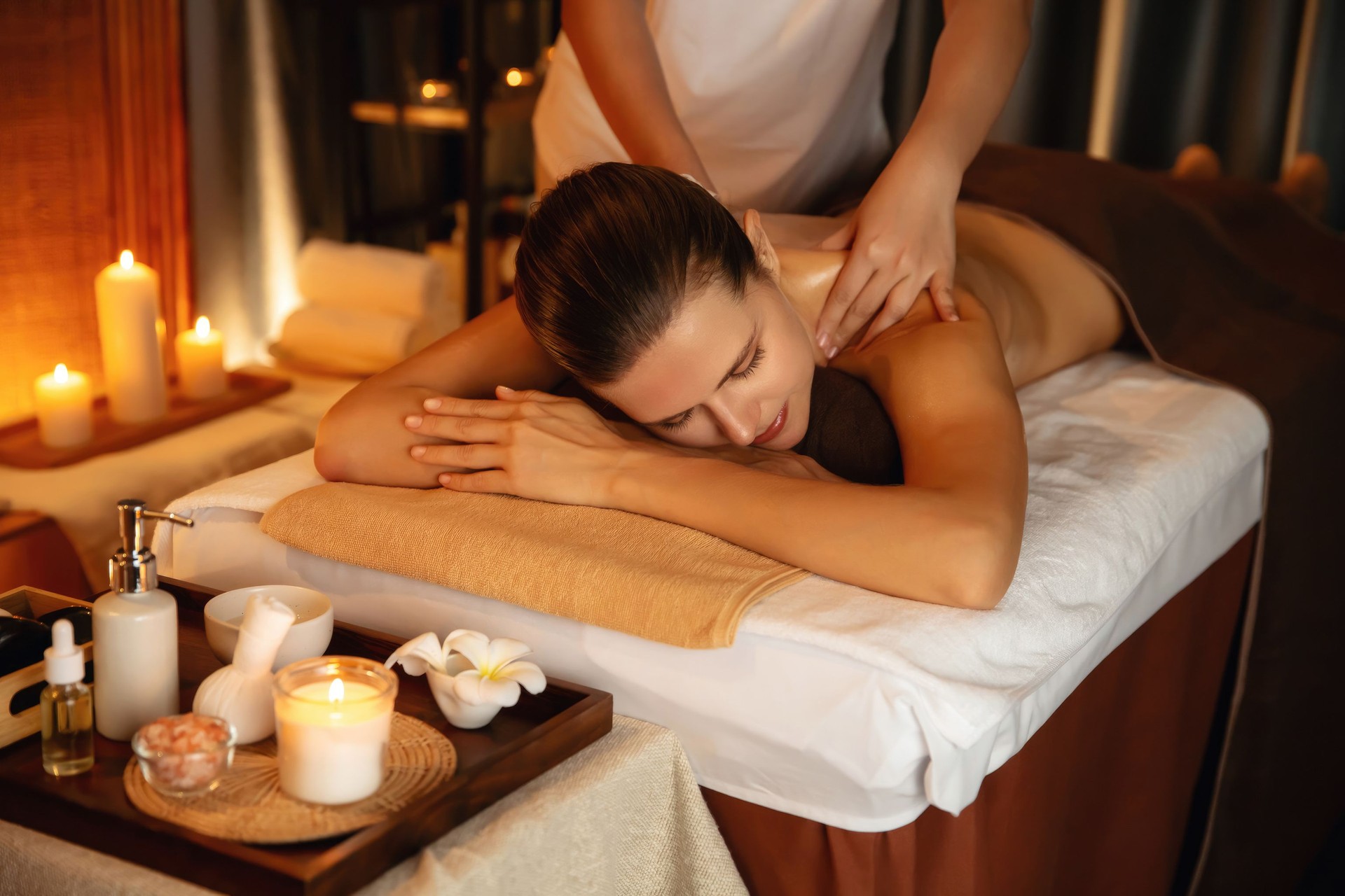 Caucasian woman customer enjoying relaxing anti-stress massage. Quiescent